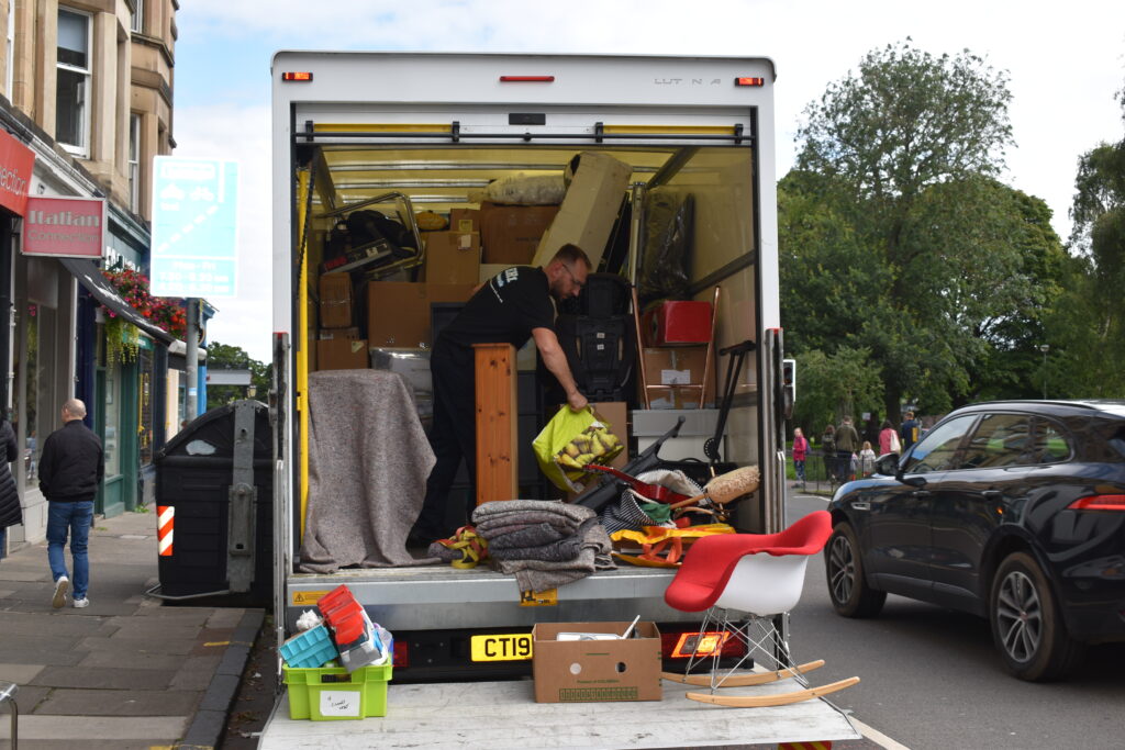 man unloading van