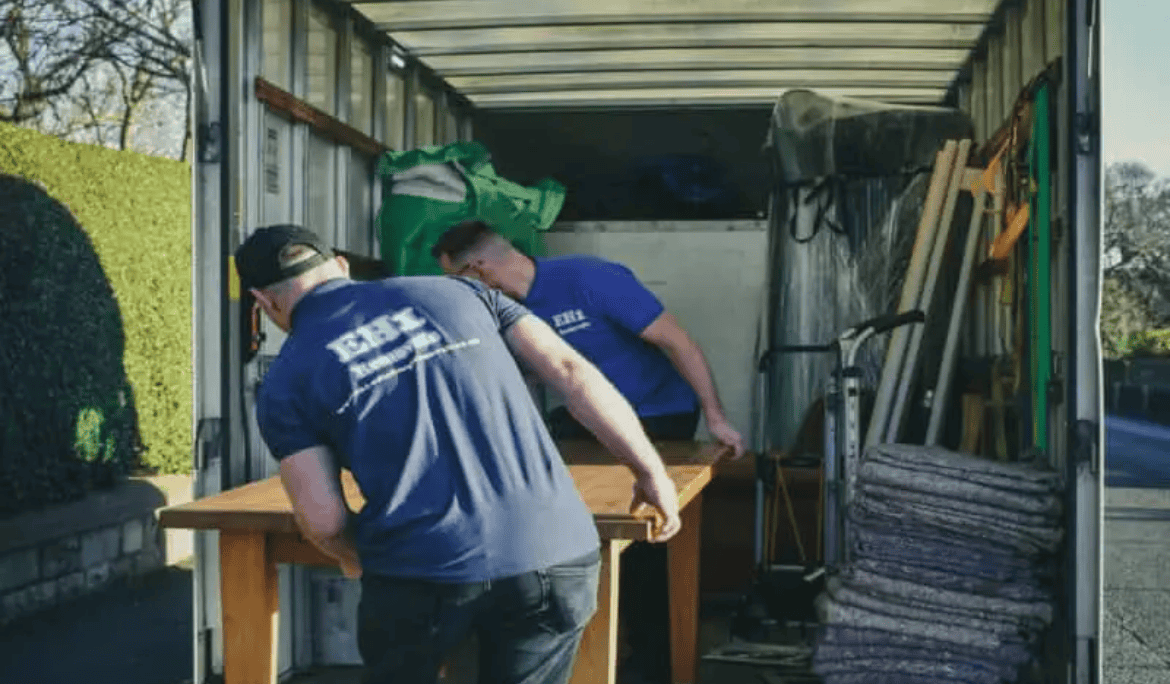 EH1 packing a table in a van during a house removal