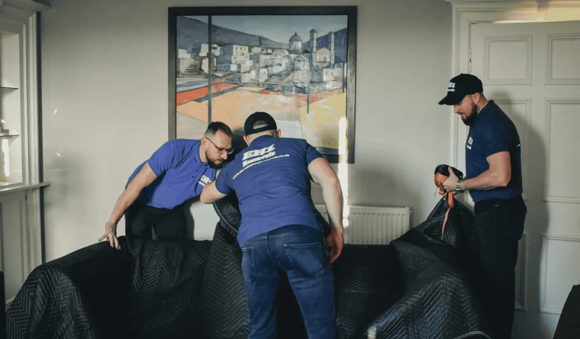 EH1 Removals carrying a sofa during a house removal
